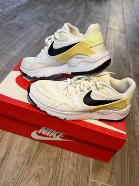 Women Nike White Sneakers with Black Swoosh and Yellow Accents